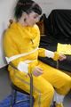 Jill tied and gagged on a chair wearing a yellow rainsuit and coveres with an yellow raincoat with two hoods (Pics)