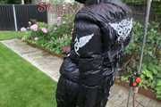 Watching Aiyana wearing a sexy black shiny nylon rainpant and a black shiny nylon down jacket trying the garden shower  (Pics)