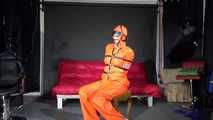 Sexy Pia wearing an oldschool orange shiny nylon rain pants and rain jacket being tied and gagged with belts and a ballgag on a chair (Video)