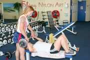 Katharina and a friend of her during their workout in the gym both wearing sexy shiny nylon shorts and tops (Pics)