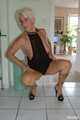 Blonde mature Claudia stipping out of a black dress