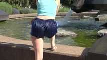 Watching SEXY SONJA walking through the city wearimg a blue shiny nylon shorts and tshirt (Video)