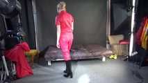 ***NEW MODELL MIA*** wearing a sexy red shiny nylon catsuit and black shiny rubber boots with heels during preparing her bed (Video)