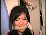 30 YR OLD ASIAN LI-JUN IS CLEAVE GAGGED, HANDGAGGED , CHAIR TIED WITH ROPE & TAPE, GETS FREE  AND OVER TAKES HER CAPTOR (D67-16)