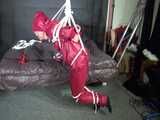 Watch Sandra beeing bound gagged and pantyhooded in her shiny nylon Rainwear