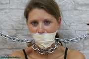 Heavy cuffed and gagged to the wall