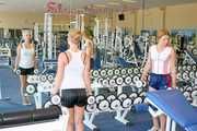 Katharina and a friend of her during their workout in the gym both wearing sexy shiny nylon shorts and tops (Pics)