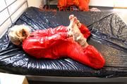 Sophie ties and gagges herself on bed wearing a beautiful red PVC sauna suit (Pics)