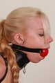 Armbinder and ballgag (credits to beltbound.com)