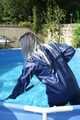 Watch Chloe cleaning the Pool in her shiny nylon Rainwear