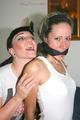 One archive girl tied and gagged by another archive girl wearing shiny nylon shorts (Pics)