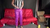 Watching sexy Pia putting on a purple shiny nylon pants of CRAZYSEBSATION and a white/black striped top (Video) 
