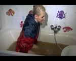 Mara wearing a sexy shiny nylon shorts and a rain jacket enjoying mud in her bath tub (Video)