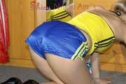 ***NEW MODEL*** Sandra wearing highheels and a sexy blue/yellow shiny nylon shorts and a yellow top during cleaning the mirror (Pics)