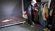 Watching sexy Pia wearing a sexy black shiny nylon jumpsuit reordering rainwear (Video)