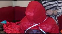 Jill tied, gagged and hooded on a chair wearing two downjackets for breath control play (Video)
