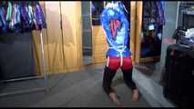 Sonja tied with ropes overhead and gagged with a clothgag wearing sexy black leather pants with a red shiny nylon shorts over it and a special blue down jacket (Video)