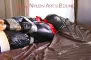 Mara tied, gagged and hooded with tape on bed wearing crazy sensation downwear in red/black (Pics)