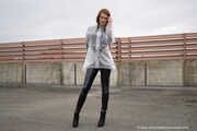 Miss Petra in transparent Hunter rain jacket and patent leggings