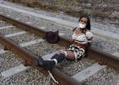 Deputy waiting for her fate at the railroad