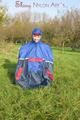 Jill wearing supersexy shiny nylon rainwear and a rain cape posing outdoor in the field (Pics)