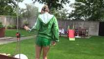 Watching sexy Sandra wearing a sexy green shiny nylon shorts and a green shiny nylon rain jacket enjoying the garden shower (Video)