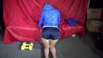Watching sexy Sonja wearing a supersexy oldschool blue shiny nylon shorts and a lightblue rain jacket during her workout with barbells (Video)