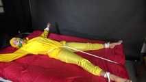 Watching sexy Pia being tied and gagged with ropes on a bed and a clothgag wearing sexy yellow shiny nylon rainwear (Video)