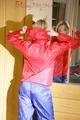 Sonja wearing a sexy red/blue rainwear combination during her workout (Pics)