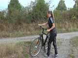 Watch Sandra riding her bike enjoying her shiny nylon Jumpsuit