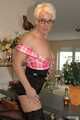 Blonde MILF Claudia strips in the kitchen