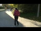 Enni taking a walk while wearing a sexy red down jacket and a shorts beneath the jeans (Video)
