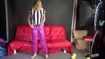 Watching sexy Pia putting on a purple shiny nylon pants of CRAZYSEBSATION and a white/black striped top (Video) 