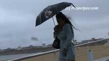 016216 Eve Takes A Very Damp Pee On The Windswept Barcelona Beachfront