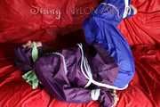 SANDRA being tied and gagged on a sofa with ropes and a clothgag wearing a sexy blue shiny nylon rain pants and a purple rain jacket (Pics)