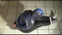 Jill bound and gagged in a shiny nylon downjacket