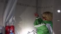 Sonja tied and gagged in a shower with tape and rope wearing a supersexy green shiny nylon shorts and rain jacket (Video)