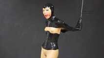 Gagged rubber doll in monogloves