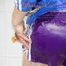 Sonja taking a shower wearing a very hot purple shiny nylon shorts and a blue rain jacket (Pics)