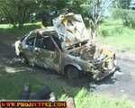 005010 Libby Climbs Up On A Burnt Out Car To Pee