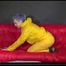 Watching Mara putting on sexy yellow shiny nylon rainwear lolling on the sofa (Video)
