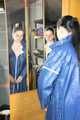 Lucy wearing sexy blue shiny nylon rainwear cleaning the mirror (Pics)