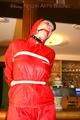 Jill tied and gagged on a pillar wearing a shiny red rainwear (Pics)